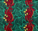 Decorative fabric pattern with red and yellow paisley design on a green geometric background