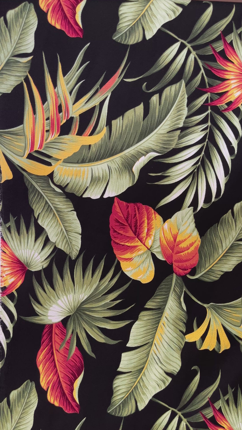 Product demonstration video of Multicolor Palm Leaves Upholstery Cotton Fabric by Islands Fabric, highlighting the detailed botanical print and rich colors of the tropical floral design.