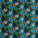Navy blue Hawaiian floral print with orange and white hibiscus flowers for custom apparel and home decor.